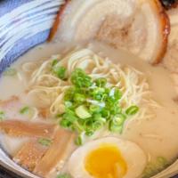 Tonkotsu Ramen · Creamy milky flavored pork broth. Served with thin noodle, 2 slices of pork chashu, bamboo s...