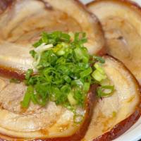 Pork Chashu Bowl · 4 pc seared homemade pork belly chashu topped with green onion. Served over a bowl of white ...