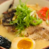 Tonkotsu Ramen · Thick pork broth serves with chashu, nitamago, bamboo shoots, and pickled gingers.