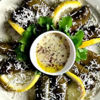 Dolma Platter (10 Pieces) · Stuffed grape leafs. Fresh marinated grape leafs filled with rice, herbs, and lemon juice to...