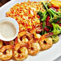 Shrimp Seafood · A delicious seafood platter containing fresh shrimp a side of sauce and a vegetable stir fry...