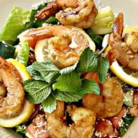 Shrimp Salad · Buttered garlic  shrimp , red onions, cucumbers, olives topped with sauce.