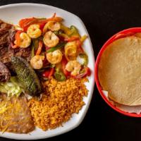 Carne Asada Con Camarones (Steak & Shrimp) · Served with rice and beans.