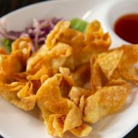 Crab Wontons · Crispy fried wontons stuffed with a combination of imitation crab meat and cream cheese. Ser...