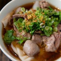 Meatball Noodle Soup · This bowl of wide rice noodles features meatballs, sliced beef, fresh bean sprouts, green on...