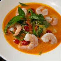 Pineapple Prawn Curry · Pineapple with peeled prawns in spicy red curry.