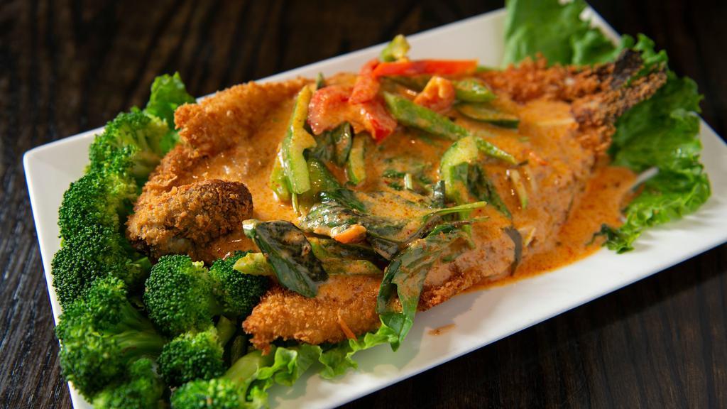 Crispy Trout Curry · Lightly panko breaded boneless trout and deep fried to a crispy golden. Topped with PA nang curry, sweet basil and bell peppers.