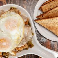 F.S. Skillet · Two eggs any style, peppers, onions, country potatoes & chicken
fried steak topped with coun...