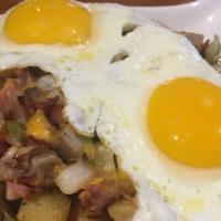 Meat Lovers Skillet · Two eggs any style with ham, bacon, sausage, onions & peppers.
Topped with melted monterrey ...