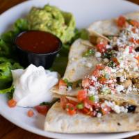 Grilled Quesadilla · Choice from chicken, ground beef or pulled pork with black beans, corn, Monterrey jack chees...