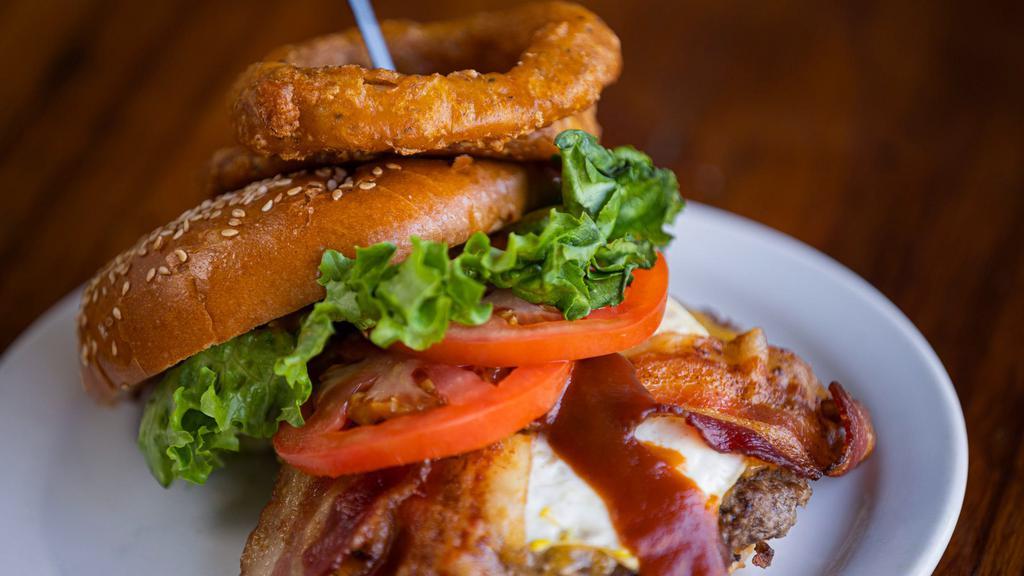 Hangover Burger · Lettuce, tomato, onion ring, fried egg, smoked bacon, tillamook
sharp cheddar cheese & BBQ sauce .