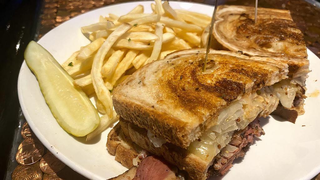 Reuben · Pastrami smothered with sauerkraut & Swiss cheese served on grilled
rye bread with 1000 island.