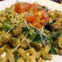 Tuscan Mac · Creamy pesto sauce, Italian sausage, bacon, capers, chicken,
spinach with fresh dices tomato...