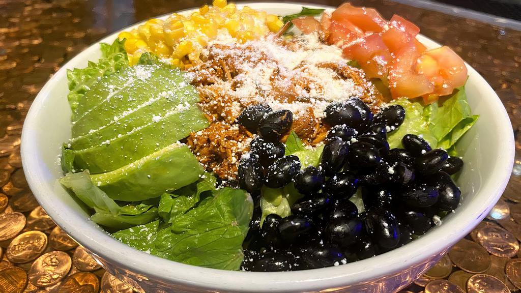 Mexican Salad Bowl
 · Choice from: seasoned ground beef, al pastor, shredder chicken or pulled pork. Black beans, corn, tomatoes, queso fresco, avocado on crispy romaine lettuce with side of ancho dressing.