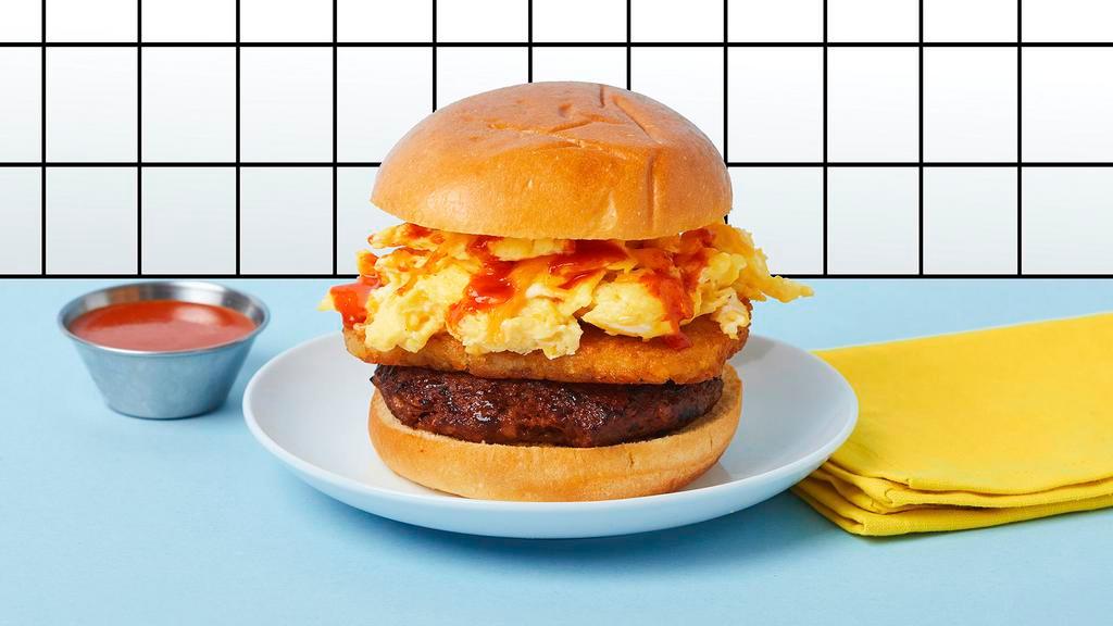 The Runyon · Egg. Sausage. Cheese. Hashbrown. A vibey egg sandwich with 2 eggs scrambled, LA Breakfast sausage, hash browns, melty cheddar cheese on a wavy brioche bun with a smooth ketchup/mayo/sriracha sauce.