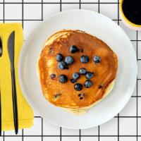 Labc Blueberry Pancakes · Two fluffy pancakes with blueberries served with a side of butter and syrup. Stack.It.Up.