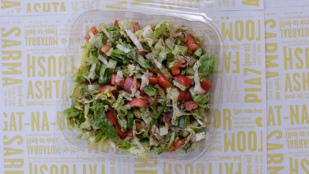 Spring Salad (Fattoush) · Chopped salad with Romaine lettuce, green onion, tomato, cucumber, bell pepper, pita chips, fresh mint, and our house dressing. Vegan