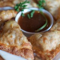 Vegetable Samosa · Fried pastries stuffed with potatoes, peas, onions, and carrots, served with sweet chili sau...