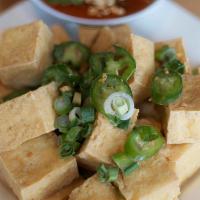 Salt & Pepper Tofu · Golden fried tofu tossed with salt and pepper, served with sweet chili sauce topped with pea...