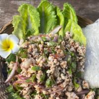 Laap Gai · Ground chicken salad with sticky rice. Ingredients: lettuce, green onion, red onion, mint, c...
