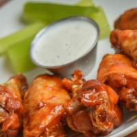 Bbq Wings · Wings tossed in house-made BBQ sauce, served with ranch dressing.