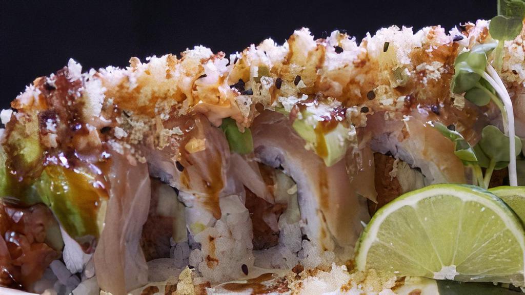 Bruce Lee Roll · Spicy tuna, cucumber, topped with albacore, avocado, shrimp tempura, jalapeno, spicy mayo, unagi sauce, and tempura flakes.