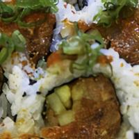 Puget Sound Roll · Assorted fish marinated in spicy sauce, sesame oil, & cucumber.