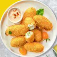 Jalapeno Snap Poppers · Fresh jalapenos filled with cream cheese, breaded, and fried until golden brown