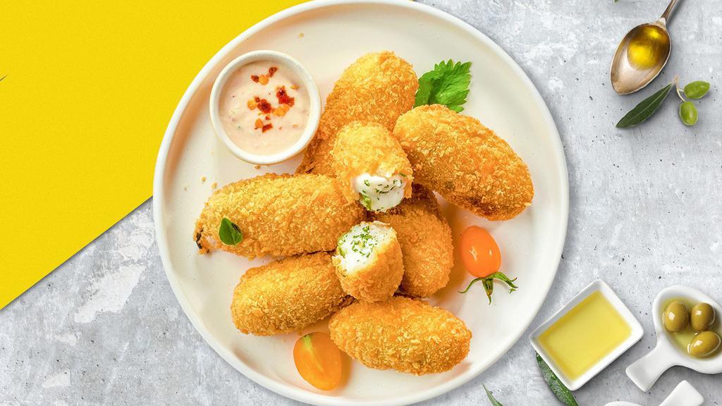 Jalapeno Snap Poppers · Fresh jalapenos filled with cream cheese, breaded, and fried until golden brown