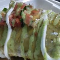 Burritos · Burritos served with house made lime rice black beans or refried beans choice of meat topped...