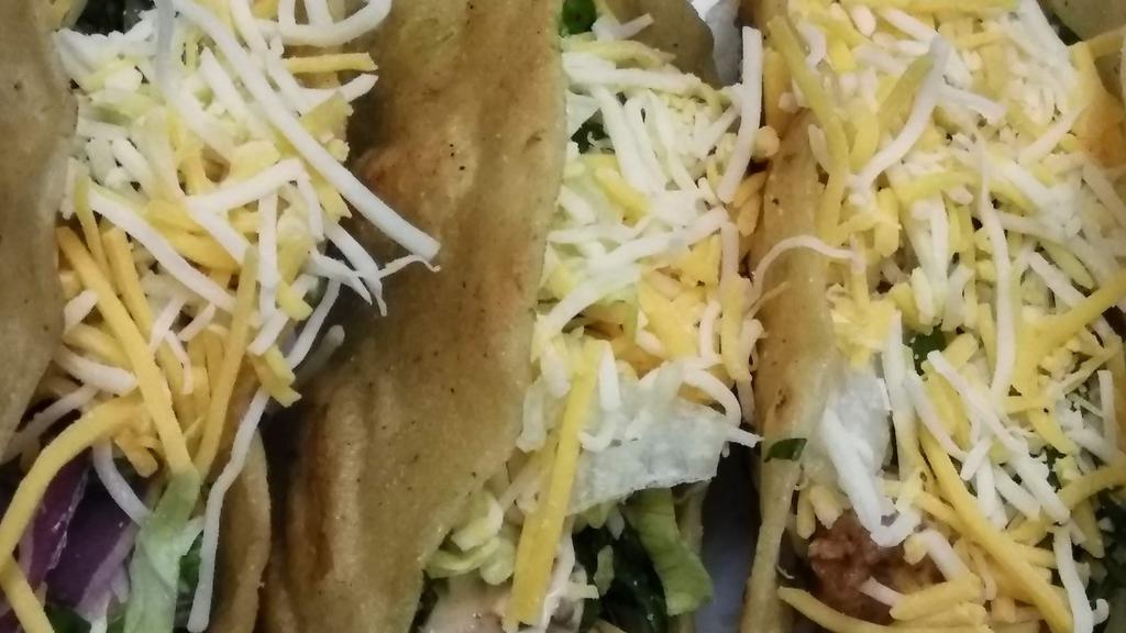 Tacos · Choice of Meat freshly prepared and cut romaine lettuce tomatoes onions cilantro served in a soft grilled corn tortillas. 
Also available in Hard Shell