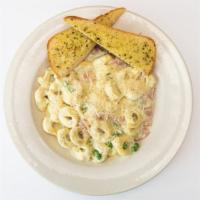 Tortellini Special · Cheese filled tortellini with smoked ham and garden peas  in our Alfredo cream sauce.