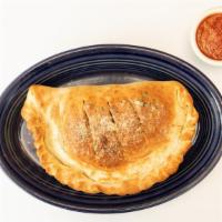 The Athenian Calzone · Pizza sauce, fennel sausage, pepperoni, mushrooms, olives, feta and mozzarella cheeses.