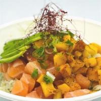 Chili Mango Salmon · Salmon tossed in a citrus ponzu sauce, served with chili mangos, avocado, and green onions t...