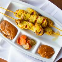 Chicken Satay · Marinated in coconut milk, curry and cilantro. Served with fresh cucumber vinaigrette and pe...