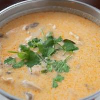 Tom Ka (Bowl) · Hot and sour soup with coconut milk, kaffir lime leaves, mushrooms, lemongrass, and cilantro.