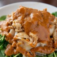 Racha Special Noodles · Stir-fried with noodles and served on spinach topped with peanut sauce.