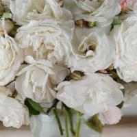 The Virgin · A dreamy all white bouquet. The variety of roses is based on what is currently in bloom on t...