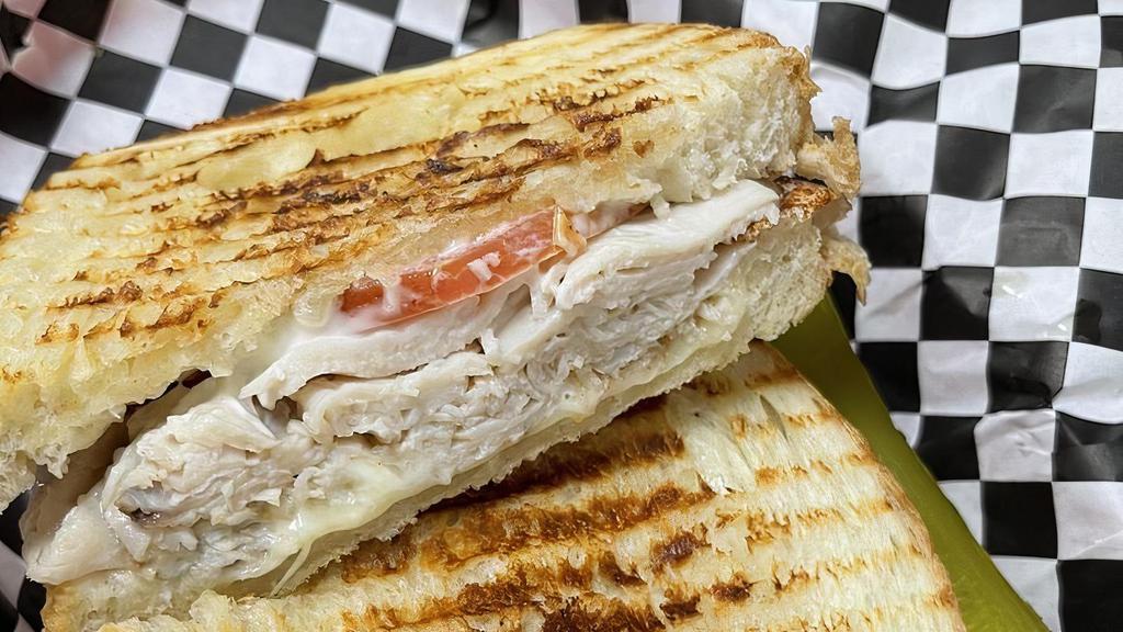 Cajun Turkey Panini · Cajun turkey breast, bacon and Pepper Jack cheese with mayo. Served on sourdough bread with tomato.