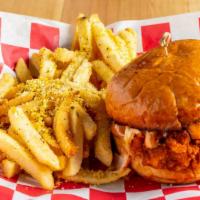 Nashville Hot Chicken Sandwich Combo Meal · House breaded chicken breast basted with Nashville spice. Served on a brioche bun with Pop's...