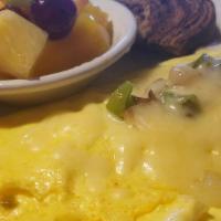 Veggie Omelet · 3 EGGS, ONIONS, MUSHROOMS BELLPEPPERS & CHEESE