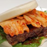 Kimchi Imposstor Bao · Impossible soy-based vegetarian protein with Korean-style spicy sauce, kimchi, and spring sa...