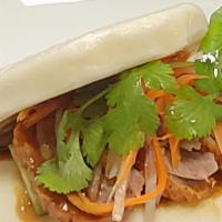 Roasted Duck Bao · Sliced roasted duck with house savory sauce, pickled cucumber, pickled carrots, daikon radis...