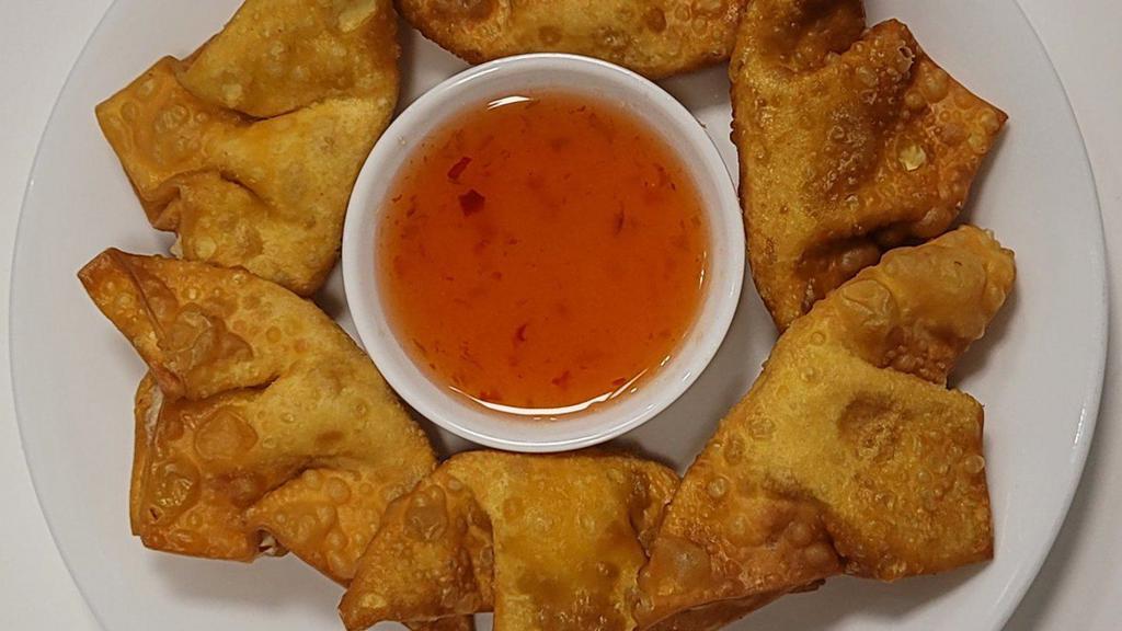 Golden Creamy Crab Wontons · 6 deep-fried handmade wontons filled with cream cheese and crab meat. Served with house sweet and sour sauce.