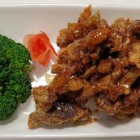 Honeyed Crispy Duck · Deep-fried boneless duck topped with house honey ginger sauce. Served with steamed broccoli ...