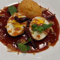 Scorched Tiger Eggs  · 2 Tiger Skin Eggs (deep-fried boiled eggs), topped with house sweet and savory sauce (tamari...