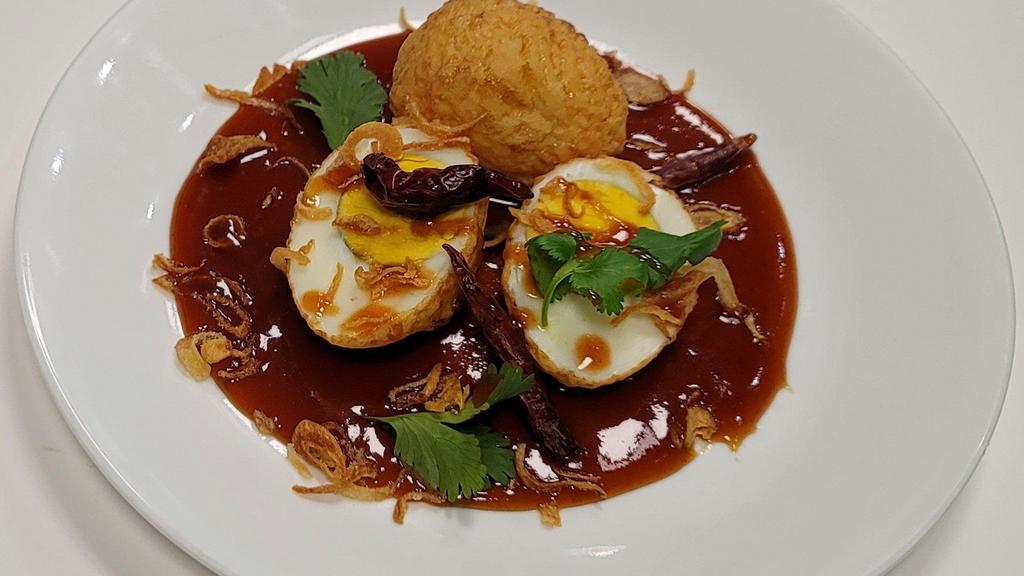 Scorched Tiger Eggs  · 2 Tiger Skin Eggs (deep-fried boiled eggs), topped with house sweet and savory sauce (tamarind sauce, fish sauce, and palm sugar), crispy red onions, dry chili, and cilantro.