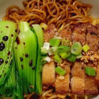 Thirsty Ramen With Sesame Pork Belly · Dry but saucy ramen noodles with our Crispy Sesame Pork Belly and bok choy, topped with hous...