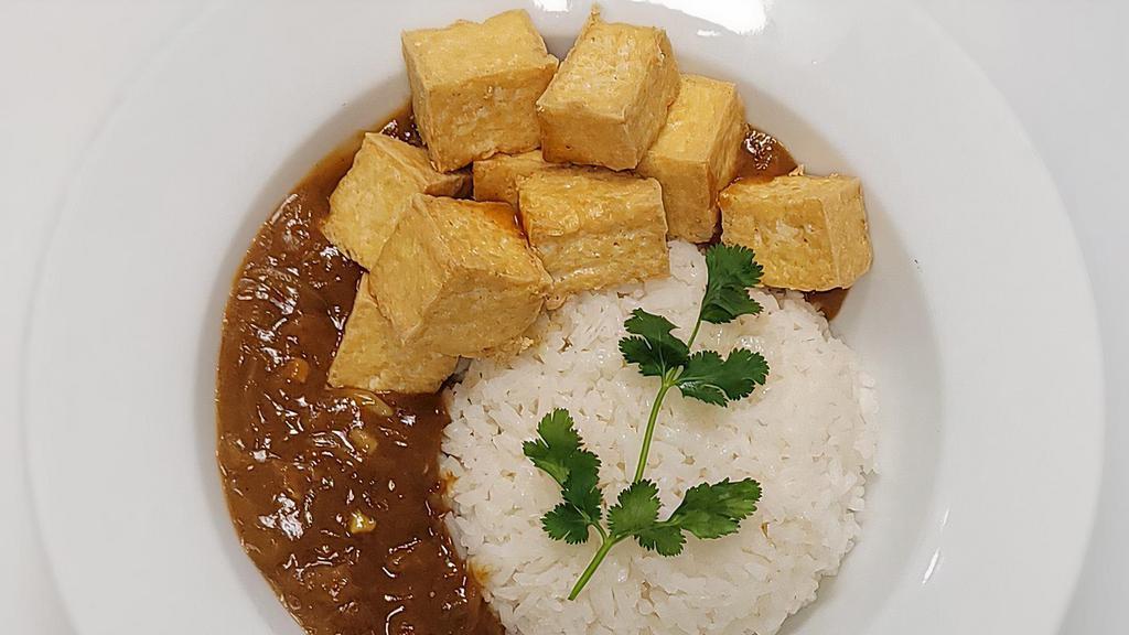 Fried Tofu Curry · Deep-fried diced tofu and Japanese-style curry sauce with garlic, ginger, and onions, topped with cilantro. Served with choice of white jasmine rice or udon noodles.