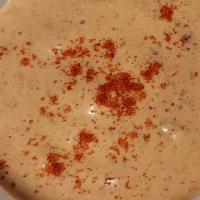 Side Of Smokin’ Chipotle Mayo Sauce · Spicy ＆ creamy condiment. Mixture of chipotle chili and mayonnaise, topped with a dash of pa...